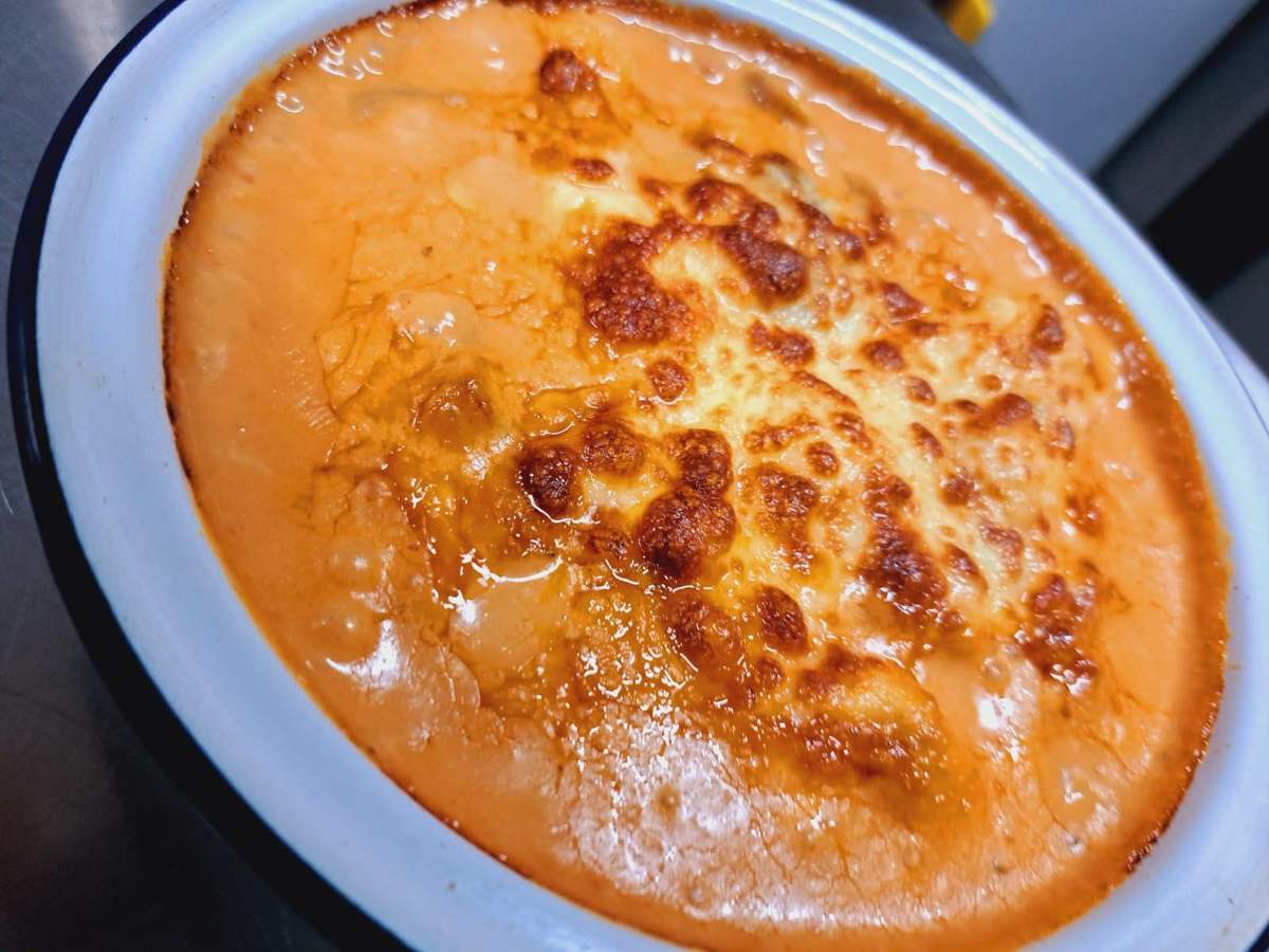 Baked pasta with a golden, bubbling cheese top