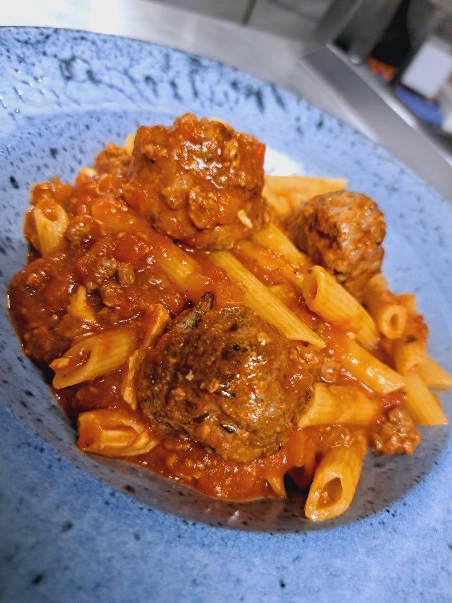Penne with meatballs in tomato sauce